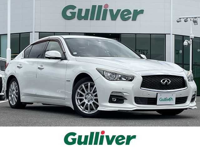 日産 スカイライン ハイブリッド 350GT Type P 佐賀県 2014(平26)年 9.2万km クリスタルホワイトパール ワンオーナー/ベージュ革シート/純正8インチSDナビ/・フルセグTV/AM/FM/CD/USB/Bluetooth/アラウンドビューモニター/ビルトインETC/D＋N席パワーシート(D席メモリー機能付)/D＋N席シートヒーター/革巻きステアリング/ステアリングリモコン/純正17インチアルミホイール/純正キセノンヘッドライト/純正LEDフォグライト/純正フロアマット/純正ドアバイザ―/新車保証書/取扱説明書/スペアキー１本/インテリジェントクルーズコントロール/車線逸脱警報（LDW）/車線逸脱防止支援システム（LDP）/ブラインドスポットワーニング/エマージェンシーブレーキ/インテリジェントペダル