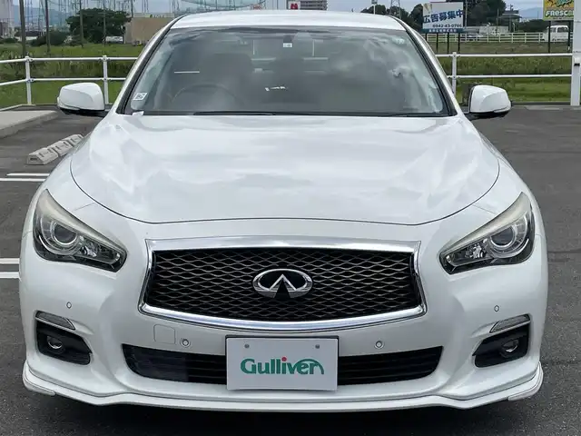 日産 スカイライン ハイブリッド 350GT Type P 佐賀県 2014(平26)年 9.2万km クリスタルホワイトパール ワンオーナー/ベージュ革シート/純正8インチSDナビ/・フルセグTV/AM/FM/CD/USB/Bluetooth/アラウンドビューモニター/ビルトインETC/D＋N席パワーシート(D席メモリー機能付)/D＋N席シートヒーター/革巻きステアリング/ステアリングリモコン/純正17インチアルミホイール/純正キセノンヘッドライト/純正LEDフォグライト/純正フロアマット/純正ドアバイザ―/新車保証書/取扱説明書/スペアキー１本/インテリジェントクルーズコントロール/車線逸脱警報（LDW）/車線逸脱防止支援システム（LDP）/ブラインドスポットワーニング/エマージェンシーブレーキ/インテリジェントペダル