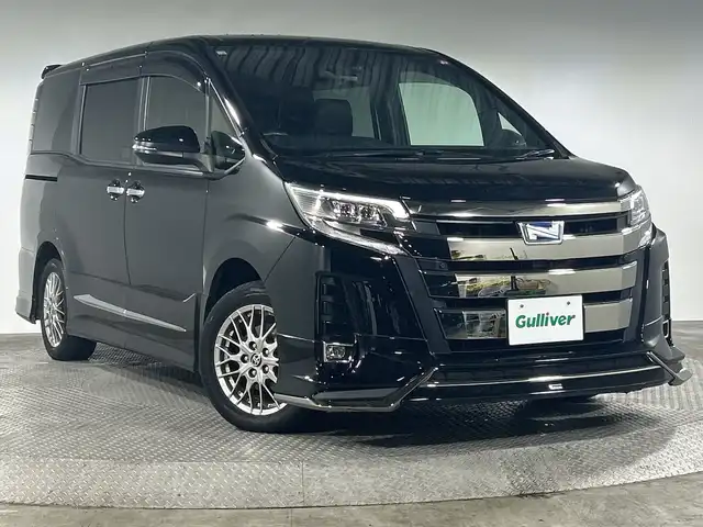 トヨタ ノア ハイブリッド Si ダブルバイビーⅡ 神奈川県 2020(令2)年 4.7万km ブラック モデリスタエアロ【フロント/サイド/リアアンダー】/純正9型ナビゲーション【NSZT-Y68T】/フルセグ　SD　Bluetooth　CD DVD　/バックカメラ/純正フリップダウンモニター/両側電動スライドドア/セーフティセンス/プリクラッシュセーフティ/レーンディパーチャーアラート/オートマチックハイビーム/先行車発進告知/クルーズコントロール/インテリジェントクリアランスソナー/アイドリングストップ/革巻きステアリング/ブラック合皮/ファブリックコンビシート/前席快適温熱シート/2列目アームレスト付きキャプテンシート/サイドテーブル/独立型センターコンソール/EV/ECO/POWERモード/純正ビルトインETC2.0/プッシュスタート/スマートキー/純正リアスポイラー/純正16インチアルミホイール/LEDヘッドランプ/オートライト/LEDフロントフォグランプ