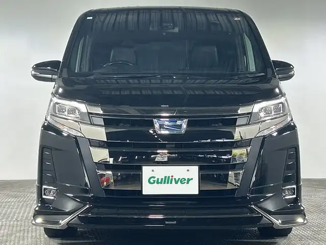 トヨタ ノア ハイブリッド Si ダブルバイビーⅡ 神奈川県 2020(令2)年 4.7万km ブラック モデリスタエアロ【フロント/サイド/リアアンダー】/純正9型ナビゲーション【NSZT-Y68T】/フルセグ　SD　Bluetooth　CD DVD　/バックカメラ/純正フリップダウンモニター/両側電動スライドドア/セーフティセンス/プリクラッシュセーフティ/レーンディパーチャーアラート/オートマチックハイビーム/先行車発進告知/クルーズコントロール/インテリジェントクリアランスソナー/アイドリングストップ/革巻きステアリング/ブラック合皮/ファブリックコンビシート/前席快適温熱シート/2列目アームレスト付きキャプテンシート/サイドテーブル/独立型センターコンソール/EV/ECO/POWERモード/純正ビルトインETC2.0/プッシュスタート/スマートキー/純正リアスポイラー/純正16インチアルミホイール/LEDヘッドランプ/オートライト/LEDフロントフォグランプ