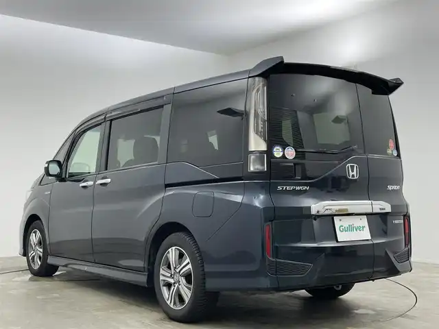 ホンダ ステップワゴン スパーダ ハイブリッド G EX ホンダセンシング 岡山県 2018(平30)年 5.2万km アビニオンブルーメタリック 純正10インチSDナビ/（CD/DVD/BT/フルセグTV/USB/HDMI）/マルチビューカメラ/フリップダウンモニター/両側パワースライドドア/（左側ハンズフリースライド）/ドライブレコーダー（前）/ハーフレザーシート/前席シートヒーター/ビルトインETC/無限フロアマット/衝突軽減ブレーキシステム/追従型クルーズコントロール/LEDヘッドライト/オートハイビーム/オートライト/オートブレーキホールド/後席サンシェイド/ステアリングスイッチ/チルトステアリング/シートリフター/シートバックテーブル/ウインカーミラー/ドアバイザー