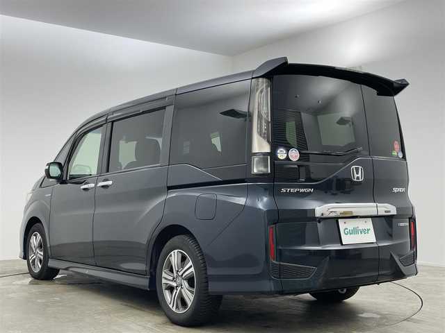 ホンダ ステップワゴン スパーダ ハイブリッド G EX ホンダセンシング 岡山県 2018(平30)年 5.2万km アビニオンブルーメタリック 純正10インチSDナビ/（CD/DVD/BT/フルセグTV/USB/HDMI）/マルチビューカメラ/フリップダウンモニター/両側パワースライドドア/（左側ハンズフリースライド）/ドライブレコーダー（前）/ハーフレザーシート/前席シートヒーター/ビルトインETC/無限フロアマット/衝突軽減ブレーキシステム/追従型クルーズコントロール/LEDヘッドライト/オートハイビーム/オートライト/オートブレーキホールド/後席サンシェイド/ステアリングスイッチ/チルトステアリング/シートリフター/シートバックテーブル/ウインカーミラー/ドアバイザー