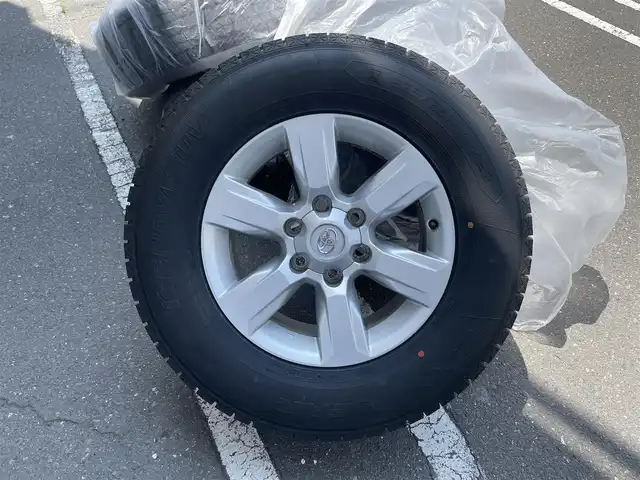 トヨタ ランドクルーザー プラド TX Lパッケージ 青森県 2016(平28)年 5.7万km ホワイトパールクリスタルシャイン 社外１７ＡＷ/7人乗り/純正ＬＥＤヘッドライト/本革シート/（運転席助手席シートヒーター）/純正ＳＤナビフルセグ（ＮＳＺＴ－Ｗ６６Ｔ）/純正１７ＡＷｘ４積み込み/クリアランスソナー/クルーズコントロール/スマートキー（1本）/新車時保証書/取扱説明書