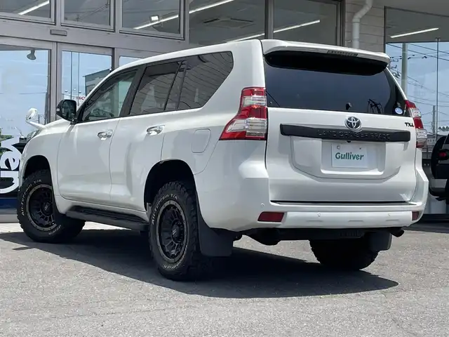 トヨタ ランドクルーザー プラド TX Lパッケージ 青森県 2016(平28)年 5.7万km ホワイトパールクリスタルシャイン 社外１７ＡＷ/7人乗り/純正ＬＥＤヘッドライト/本革シート/（運転席助手席シートヒーター）/純正ＳＤナビフルセグ（ＮＳＺＴ－Ｗ６６Ｔ）/純正１７ＡＷｘ４積み込み/クリアランスソナー/クルーズコントロール/スマートキー（1本）/新車時保証書/取扱説明書