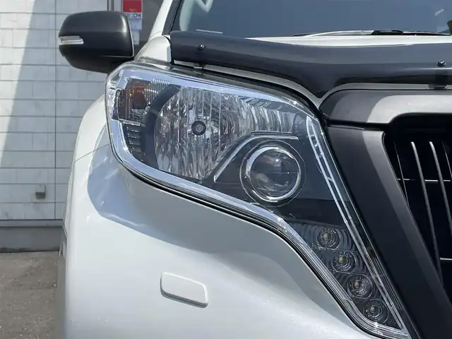 トヨタ ランドクルーザー プラド TX Lパッケージ 青森県 2016(平28)年 5.7万km ホワイトパールクリスタルシャイン 社外１７ＡＷ/7人乗り/純正ＬＥＤヘッドライト/本革シート/（運転席助手席シートヒーター）/純正ＳＤナビフルセグ（ＮＳＺＴ－Ｗ６６Ｔ）/純正１７ＡＷｘ４積み込み/クリアランスソナー/クルーズコントロール/スマートキー（1本）/新車時保証書/取扱説明書