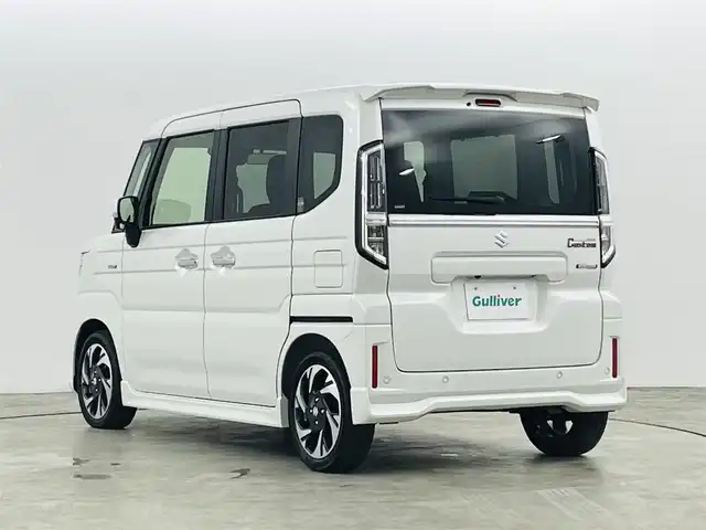 スズキ スペーシア カスタム HYBRID XS ターボ 福島県 2023(令5)年 0.1千km ピュアホワイトP スズキセーフティサポート/・衝突被害軽減ブレーキ/・誤発進抑制機能/・低速時ブレーキサポート/・先行車発進お知らせ機能/・標識認識機能/・車線逸脱警報装置/・電子パーキング/・オートブレーキホールド/アダプティブクルーズコントロール/純正ナビゲーション/・型番：NVF-0239zs03/・AppleCarPlay/AndroidAuto/・フルセグTV/BT/FM/AM/CD/DVD/・バックカメラ/・アラウンドビューモニター/革巻きステアリング/・ステアリングスイッチ/・パドルシフト/・ステアリングヒーター/ハーフレザーシート/・シートヒーター/・ベンチシート/USB充電ポート/プッシュスタート/・スマートキー/電動格納ミラー/・ウィンカーミラー/・オートミラー/LEDヘッドライト/・オートライト/・フォグランプ/純正フロアマット/純正15インチAW