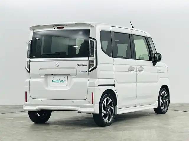 スズキ スペーシア カスタム HYBRID XS ターボ 福島県 2023(令5)年 0.1千km ピュアホワイトP スズキセーフティサポート/・衝突被害軽減ブレーキ/・誤発進抑制機能/・低速時ブレーキサポート/・先行車発進お知らせ機能/・標識認識機能/・車線逸脱警報装置/・電子パーキング/・オートブレーキホールド/アダプティブクルーズコントロール/純正ナビゲーション/・型番：NVF-0239zs03/・AppleCarPlay/AndroidAuto/・フルセグTV/BT/FM/AM/CD/DVD/・バックカメラ/・アラウンドビューモニター/革巻きステアリング/・ステアリングスイッチ/・パドルシフト/・ステアリングヒーター/ハーフレザーシート/・シートヒーター/・ベンチシート/USB充電ポート/プッシュスタート/・スマートキー/電動格納ミラー/・ウィンカーミラー/・オートミラー/LEDヘッドライト/・オートライト/・フォグランプ/純正フロアマット/純正15インチAW