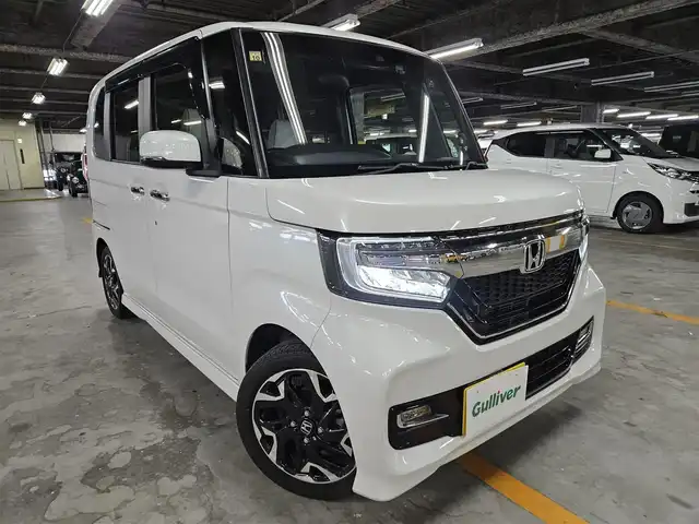 ホンダ Ｎ ＢＯＸ カスタム G L ターボ ホンダセンシング 愛媛県 2018(平30)年 4.2万km プラチナホワイトパール 〇純正８インチナビ/〇フルセグTV/〇バックカメラ/〇フリップダウンモニター/〇ビルトインETC/〇ドライブレコーダー/〇パワースライドドア（両側）/〇ホンダセンシング/・衝突軽減ブレーキ/・誤発進抑制機能/・アダプティブクルーズコントロール/〇LEDヘッドランプ/〇オートライト/〇純正15インチアルミ/〇オートエアコン/〇革巻きステアリング/〇パドルシフト/〇ステアリングスイッチ/〇合皮/ファブリックコンビシート/〇シートカバー取付け/〇スマートキーシステム/〇ターボ/〇禁煙車