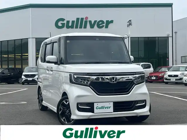 ホンダ Ｎ ＢＯＸ カスタム G L ターボ ホンダセンシング 愛媛県 2018(平30)年 4.2万km プラチナホワイトパール 登録時走行距離42099km/純正8インチナビ（VXU-195NBi）/CD/DVD/フルセグTV/Bluetooth/バックカメラ/フリップダウンモニター/純正ドライブレコーダー（フロント）/ビルトインETC/ホンダセンシング/衝突軽減ブレーキ/レーンキープサポート/追従クルーズコントロール/リヤコーナーセンサー/両側パワースライドドア/ロールサンシェード/スマートキー/オートライト/LEDヘッドライト/LEDフォグランプ/純正アルミホイール