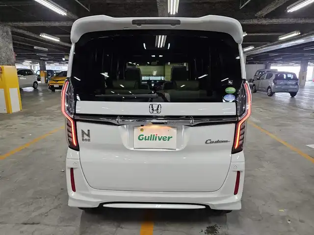 ホンダ Ｎ ＢＯＸ カスタム G L ターボ ホンダセンシング 愛媛県 2018(平30)年 4.2万km プラチナホワイトパール 〇純正８インチナビ/〇フルセグTV/〇バックカメラ/〇フリップダウンモニター/〇ビルトインETC/〇ドライブレコーダー/〇パワースライドドア（両側）/〇ホンダセンシング/・衝突軽減ブレーキ/・誤発進抑制機能/・アダプティブクルーズコントロール/〇LEDヘッドランプ/〇オートライト/〇純正15インチアルミ/〇オートエアコン/〇革巻きステアリング/〇パドルシフト/〇ステアリングスイッチ/〇合皮/ファブリックコンビシート/〇シートカバー取付け/〇スマートキーシステム/〇ターボ/〇禁煙車
