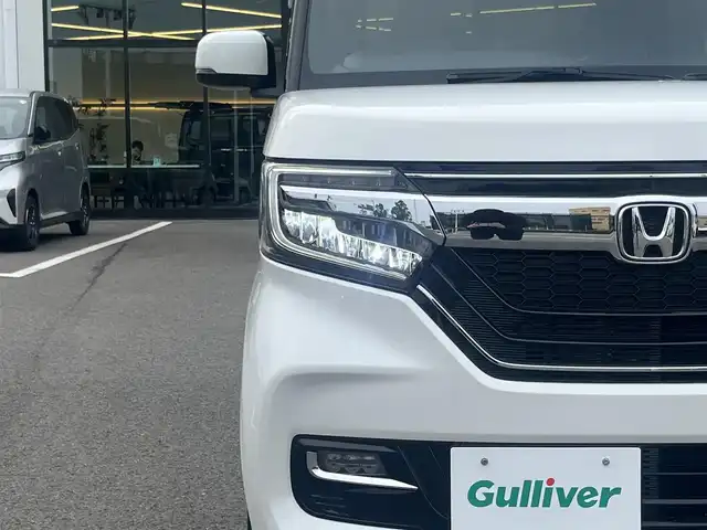 ホンダ Ｎ ＢＯＸ カスタム G L ターボ ホンダセンシング 愛媛県 2018(平30)年 4.2万km プラチナホワイトパール 登録時走行距離42099km/純正8インチナビ（VXU-195NBi）/CD/DVD/フルセグTV/Bluetooth/バックカメラ/フリップダウンモニター/純正ドライブレコーダー（フロント）/ビルトインETC/ホンダセンシング/衝突軽減ブレーキ/レーンキープサポート/追従クルーズコントロール/リヤコーナーセンサー/両側パワースライドドア/ロールサンシェード/スマートキー/オートライト/LEDヘッドライト/LEDフォグランプ/純正アルミホイール