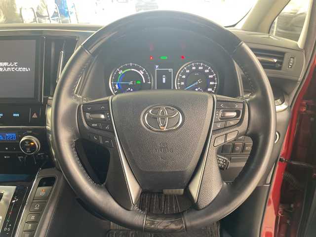 トヨタ ヴェルファイア ハイブリット ZR 道央・札幌 2018(平30)年 4.4万km ダークレッドマイカメタリック ・４WD/ハイブリッド/・トヨタセーフティセンス/・レーダークルーズコントロール/・プリクラッシュセーフティ/・純正10インチSDナビ/・DVD.CD.SD.フルセグ/・Bluetooth/バックカメラ /・フリップダウン モニター/・両側パワースライドドア /・パワーバックドア /オットマンシート/・黒レザーシート/シートヒーター/・パワーシート/ベンチレーション/・LEDライト/オートハイビーム/・３眼ヘッドライト/・ビルトインETC