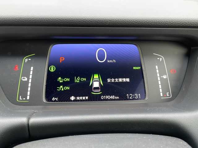 ホンダ フィット e:HEVホーム 道東・釧路十勝 2021(令3)年 1.9万km プレミアムサンライトホワイトパール 4WD/純正９インチナビ　/(AM/FM/フルセグTV/ＤＶＤ再生/Ｂｌｕｅｔｏｏｔｈ接続)/前後ドライブレコーダー　/ＥＴＣ　/バックカメラ/電動パーキングブレーキ　/渋滞追従機能付アダプティブ・クルーズ・コントロール/前後コーナーセンサー　/レーンアシスト　/衝突軽減ブレーキ/横滑り防止装置/アイドリングストップ　/スマートキー/プッシュスタート　/純正ＬＥＤヘッドライト/純正フロアマット/社外15インチアルミホイール/サマータイヤ積み込み/・195/60/R15/・社外アルミホイール/・溝5ミリ