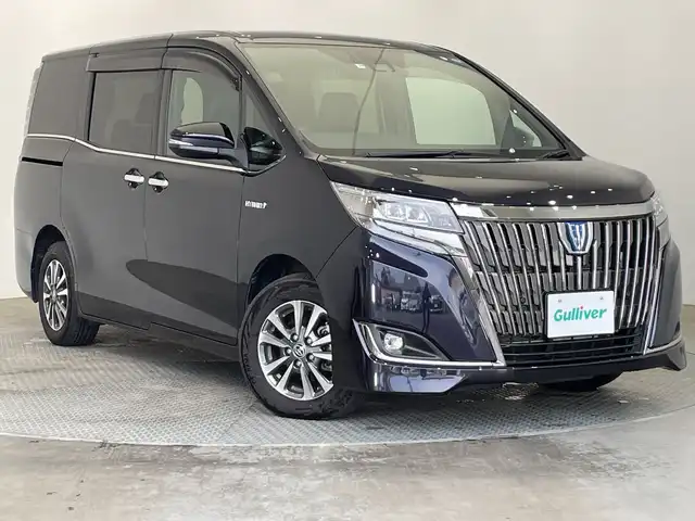 トヨタ エスクァイア ハイブリッド 栃木県 2019(令1)年 3.8万km スパークリングブラックパールクリスタルシャイン 純正10インチナビ/（CD/DVD/Bluetooth/SD/iPod）/バックカメラ/純正ビルトインETC/トヨタセーフティセンス/・プリクラッシュセーフティ/・レーンディパーチャーアラート/・オートマチックハイビーム/・先行発進車お知らせ/・クリアランスソナー/PKSB/前方ドラレコ/両側パワースライドドア/ハーフレザーシート/シートヒーター/禁煙車/ステアリングヒーター/フリップダウンモニター/オートライト/LEDヘッドライト/AC100V電源/スマートキー/プッシュスタート/ステアリングスイッチ/電動格納ミラー/純正アルミホイール/純正フロアマット