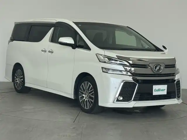 トヨタ ヴェルファイア Z Gエディション 広島県 2016(平28)年 4.8万km ホワイトパールクリスタルシャイン 純正ナビ/後席フリップダウン/バックカメラ/クルーズコントロール/パワーシート/ハーフレザー/ステアリングヒーター/電動リアゲード/Bluetooth/フルセグTV/ETC装備/両側パワースライドドア/オットマン/オートホールド/メモリシート/サンシェード/後席オートエアコン/ソナー/純正18インチAW