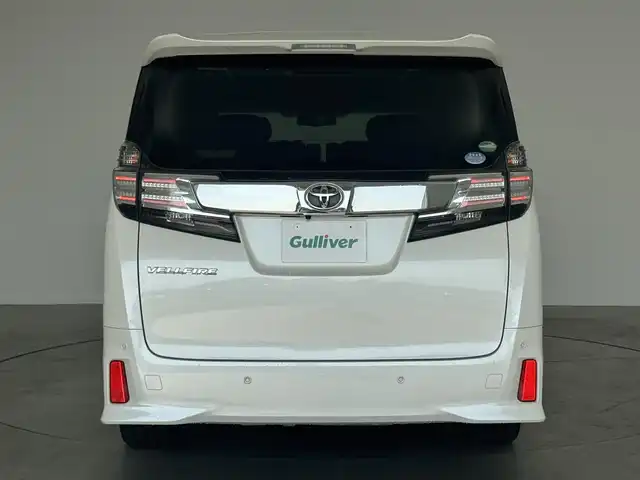 トヨタ ヴェルファイア Z Gエディション 広島県 2016(平28)年 4.8万km ホワイトパールクリスタルシャイン 純正ナビ/後席フリップダウン/バックカメラ/クルーズコントロール/パワーシート/ハーフレザー/ステアリングヒーター/電動リアゲード/Bluetooth/フルセグTV/ETC装備/両側パワースライドドア/オットマン/オートホールド/メモリシート/サンシェード/後席オートエアコン/ソナー/純正18インチAW