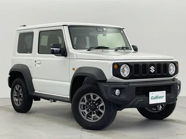 スズキ ジムニー シエラ JC 富山県 2023(令5)年 2.1万km ピュアホワイトP 4WD/社外メモリナビ（AM/FM/CD/USB/BT）/ワンセグTV/バックカメラ/デュアルセンサーブレーキサポート/レーンキープアシスト/クルーズコントロール/横滑り防止装置/ETC/ドライブレコーダー前後/純正15インチAW/前席シートヒーター/ダウンヒルアシストコントロール/LEDヘッドライト/フォグランプ/オートライト/ヘッドライトウォッシャー/社外タイヤカバー/プッシュスタート/スマートキー（スペアキー有）/純正フロアマット/取扱説明書/保証書