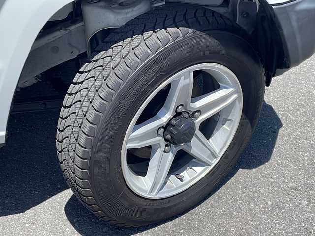 スズキ ジムニー XG 長野県 2021(令3)年 1.1万km スペリアホワイト ４WD/レーダーブレーキ /社外16インチアルミ/ケンウッドBluetooth/ビルトインETC/キーレス/純正フロアマット
