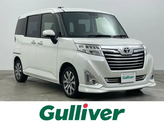 トヨタ ルーミー カスタムG－T 広島県 2020(令2)年 4.5万km パールホワイトⅢ 純正９インチナビ	/【ナビ/フルセグ/Bluetooth/DVD】	/パノラミックビューモニター	/クルーズコントロール	/オートハイビーム	/LEDヘッドライト（AUTO機能付き）	/ビルトインETC2.0	/前席シートヒーター	/衝突軽減ブレーキシステム	/車線逸脱防止システム	/横滑り防止装置	/踏み間違い防止装置/純正ドライブレコーダー（前）	/純正15インチアルミ	/コーナーセンサー（前後）	/社外フロントスポイラー/純正フロアマット	/ステアリングスイッチ	/チルトステアリング/シートリフター/シートバックテーブル/ウィンカーミラー	/プッシュスタート