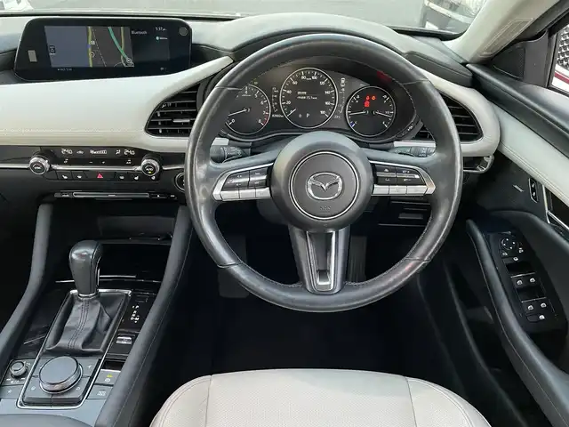 マツダ マツダ３セダン X Lパッケージ 島根県 2019(令1)年 8.2万km マシーングレープレミアムM 登録時走行距離　82602km/４WD/純正ナビ/Bluetooth/DVD/AM/FM/CD/USB)/BOSEサウンド/フルセグテレビ/追従型クルーズコントロール/純正アルミ１８インチ/全周囲カメラ/ETC/パワーシート（D席）/メモリーシート/シートヒーター（DN席）/レーンキープアシスト/ステアリングヒーター/ブラインドスポットモニター/ヘッドアップディスプレイ