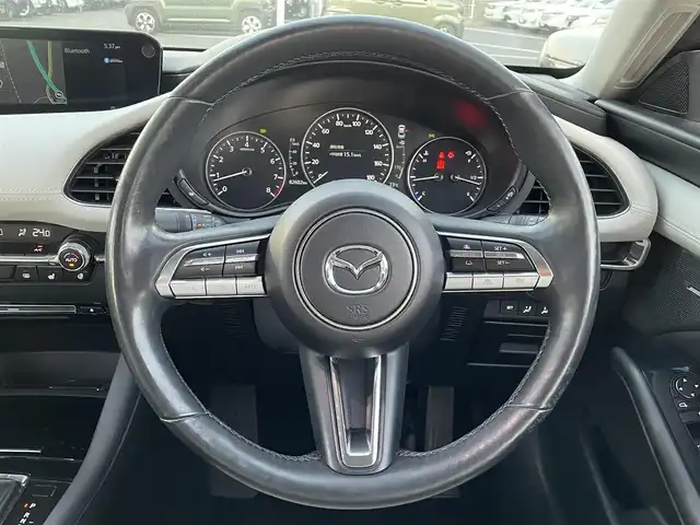 マツダ マツダ３セダン X Lパッケージ 島根県 2019(令1)年 8.2万km マシーングレープレミアムM 登録時走行距離　82602km/４WD/純正ナビ/Bluetooth/DVD/AM/FM/CD/USB)/BOSEサウンド/フルセグテレビ/追従型クルーズコントロール/純正アルミ１８インチ/全周囲カメラ/ETC/パワーシート（D席）/メモリーシート/シートヒーター（DN席）/レーンキープアシスト/ステアリングヒーター/ブラインドスポットモニター/ヘッドアップディスプレイ