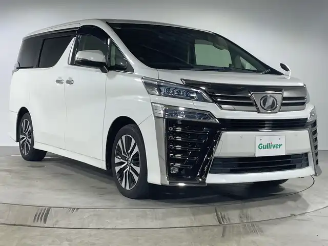 トヨタ ヴェルファイア Z Gエディション 福岡県 2019(令1)年 7.7万km ホワイトパールクリスタルシャイン 純正9型メモリーナビゲーション/フルセグテレビ/バックカメラ/純正ドライブレコーダー/ビルトインETC/純正フリップダウンモニター/両側パワースライドドア/LEDヘッドライト/純正18インチアルミホイール/レーダークルーズコントロール/3列シート/オートライト/オートハイビーム/コーナーセンサー/スマートキー/プッシュスタートエンジン