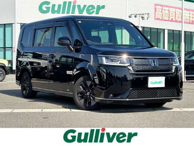 ホンダ ステップワゴン スパーダ eHEV 佐賀県 2024(令6)年 2.2万km 黒 純正11.4インチナビ/フルセグTV/Bluetooth/USB/１２Vソケット/バックカメラ/前後純正ドラレコ/両側パワースライドドア/アダクティブクルーズコントロール/ハーフレザーシート/シートヒーター/オートマチックハイビーム/ビルトインETC/純正16インチアルミ/純正フロアマット/新車保証書/取扱説明書/スペアキー1本/ホンダセンシング/横滑り防止機能/レーンキープアシスト/衝突被害軽減システム/ブラインドスポットモニター