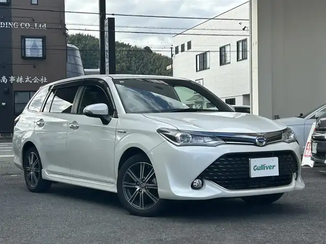 トヨタ カローラ フィールダー ハイブリッドG ダブルバイビー 静岡県 2015(平27)年 6.7万km ホワイトパールクリスタルシャイン 純正ナビ/フルセグTV/DVD/CD/SD/MSV/BT/バックカメラ/ハーフレザーシート/プリクラッシュセーフティ/レーンキープアシスト/オートハイビーム/ステアリングスイッチ/ビルトインETC/LEDヘッドライト/純正16インチAW/保証書/取扱説明書/ナビ取扱説明書/H30/R5/R6/R7点検記録簿有