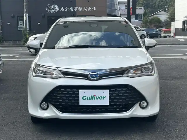 トヨタ カローラ フィールダー ハイブリッドG ダブルバイビー 静岡県 2015(平27)年 6.7万km ホワイトパールクリスタルシャイン 純正ナビ/フルセグTV/DVD/CD/SD/MSV/BT/バックカメラ/ハーフレザーシート/プリクラッシュセーフティ/レーンキープアシスト/オートハイビーム/ステアリングスイッチ/ビルトインETC/LEDヘッドライト/純正16インチAW/保証書/取扱説明書/ナビ取扱説明書/H30/R5/R6/R7点検記録簿有