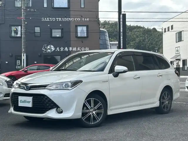 トヨタ カローラ フィールダー ハイブリッドG ダブルバイビー 静岡県 2015(平27)年 6.7万km ホワイトパールクリスタルシャイン 純正ナビ/フルセグTV/DVD/CD/SD/MSV/BT/バックカメラ/ハーフレザーシート/プリクラッシュセーフティ/レーンキープアシスト/オートハイビーム/ステアリングスイッチ/ビルトインETC/LEDヘッドライト/純正16インチAW/保証書/取扱説明書/ナビ取扱説明書/H30/R5/R6/R7点検記録簿有