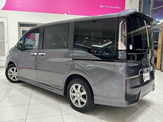 ホンダ ステップワゴン スパーダ ハイブリッド G ホンダセンシング 埼玉県 2018(平30)年 6.3万km モダンスティールM ホンダセンシング/10インチ純正メモリーナビ/ CD/DVD/BT/USB/HDMI/フルセグ/AppleCarPlay/フリップダウンモニター/両側電動スライドドア/アダクティブクルーズコントロール/レーンキープアシスト/オートブレーキホールド/パーキングセンサー/スマートキー/ETC/禁煙車