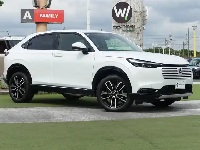 ホンダ ヴェゼル ハイブリッド e:HEV Z 千葉県 2025(令7)年 0.1万km未満 プラチナホワイトパール e:HEV Z　3VC4AG3　Honda CONNECTディスプレー+ETC2.0車載器+ワイヤレス充電器(220/000)/ホンダセンシング/・衝突軽減ブレーキ（CMBS）/・車線維持支援システム（LKAS）/・アダプティブクルーズコントロール（ACC）/・後方誤発進抑制機能/・誤発進抑制機能/パワーバックドア/ハーフレザーシート/前席シートヒーター/純正コネクトナビ/地デジTV/【Bluetooth接続】/【Apple CarPlay　Android Auto対応】/バックカメラ/ワイヤレス充電/革巻きステアリング/ステアリングスイッチ/パドルシフト/ETC（2.0）/LEDヘッドライト/フォグライト/ウインカーミラー/コーナーセンサー/純正18インチアルミホイル/サイド/カーテンエアバッグ/Honda スマートキー