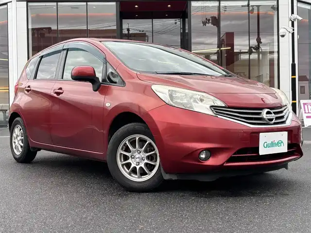 日産 ノート X DIG－S 宮城県 2012(平24)年 8万km ラディアントレッド 登録時走行距離79502km/社外SDナビ/FM・AM・TV・Bluetooth・CD/ETC/アイドリングストップ/スマートキー/スペアキーあり/スタッドレスタイヤ4本/ヘッドライトイベライザー/シフトロック機能/電動格納ミラー/ドアバイザー/純正フロアマット/社外アルミホイール/ECOモード