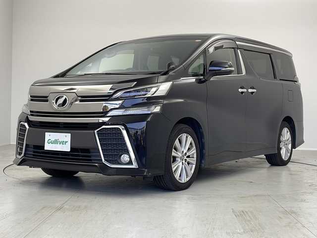 トヨタ ヴェルファイア Z 茨城県 2016(平28)年 6.1万km ブラック ９インチナビ　フルセグＴＶ　両側電動スライドドア　後席モニター　オットマン　ＥＴＣ　１００Ｖ充電　パーキングアシスト　横滑り防止装置　衝突被害軽減ブレーキ　純正１８インチアルミホイール　ＬＥＤライト