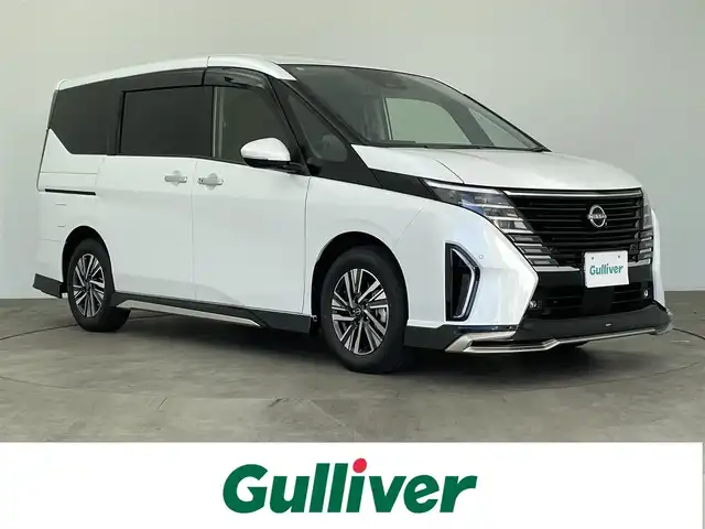 日産 セレナ e－パワー ハイウェイスター V 大分県 2025(令7)年 0.3万km プリズムホワイト フロントバンパーイルミネーション/ルーフスポイラー/AWINスポイラー(F/S/R)/プロパイロット搭載/アラウンドビューモニター/純正12.3インチナビ/・フルセグTV、HDMI、USB、AM/FM/・AppleCarPlay、AndroidAuto/ステアリングスイッチ/後席フリップダウンモニター/デジタルインナーミラー(ドラレコ機能付)/両側パワースライドドア/電動パーキングブレーキ/オートホールド機能/ETC2.0/オートリトラミラー/オートライト/LEDヘッドライト/純正アルミホイール/コーナーセンサー/保証書、取扱説明書、スペアキー有り