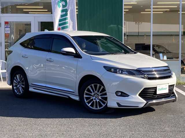 トヨタ ハリアー プレミアム 愛媛県 2016(平28)年 8.8万km ホワイトパールクリスタルシャイン メーカーオプションナビ/ＪＢＬサウンドシステム/・CD/DVD/Blu-ray/・フルセグTV/Bluetooth/SD/バックカメラ/モデリスタエアロ/・フロントスポイラー/・サイドスポイラー/・リアアンダースポイラー/・マフラー/革シート/・D席パワーシート/パワーバックドア/クルーズコントロール/レーンキープアシスト/ETC/純正アルミホイール/LEDオートライト/・オートハイビーム/取扱説明書/保証書