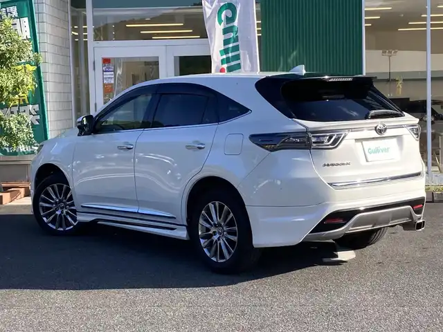 トヨタ ハリアー プレミアム 愛媛県 2016(平28)年 8.8万km ホワイトパールクリスタルシャイン メーカーオプションナビ/ＪＢＬサウンドシステム/・CD/DVD/Blu-ray/・フルセグTV/Bluetooth/SD/バックカメラ/モデリスタエアロ/・フロントスポイラー/・サイドスポイラー/・リアアンダースポイラー/・マフラー/革シート/・D席パワーシート/パワーバックドア/クルーズコントロール/レーンキープアシスト/ETC/純正アルミホイール/LEDオートライト/・オートハイビーム/取扱説明書/保証書