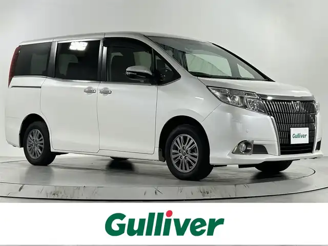 トヨタ エスクァイア Xi ウェルジョイン 佐賀県 2015(平27)年 2.1万km ホワイトパールクリスタルシャイン 福祉車両スローパー/純正9インチナビ/バックカメラ/フルセグテレビ/CD/DVD/BT/SD/FM.AM/後席フリップダウンモニター/両側パワースライドドア/プッシュスタート/コーナーセンサー/プリクラッシュセーフティ/レーンディパーチャーアラート/オートハイビーム/純正15インチアルミホイール/スマートキー×2/保証書/取扱説明書