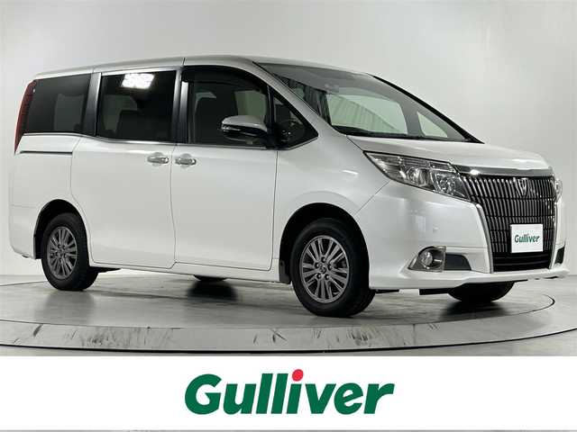 トヨタ エスクァイア Xi ウェルジョイン 佐賀県 2015(平27)年 2.1万km ホワイトパールクリスタルシャイン 福祉車両スローパー/純正9インチナビ/バックカメラ/フルセグテレビ/CD/DVD/BT/SD/FM.AM/後席フリップダウンモニター/両側パワースライドドア/プッシュスタート/コーナーセンサー/プリクラッシュセーフティ/レーンディパーチャーアラート/オートハイビーム/純正15インチアルミホイール/スマートキー×2/保証書/取扱説明書