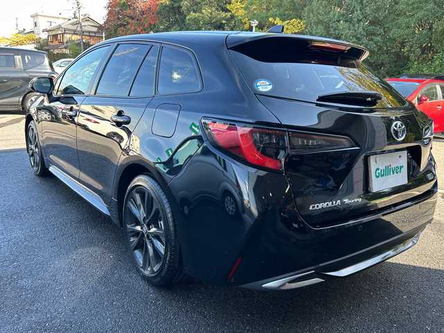 トヨタ カローラツーリング ハイブリッド ダブルバイビー 大阪府 2023(令5)年 1.1万km アティチュードブラックマイカ ワンオーナー/ブラインドスポットモニター/純正10.5型ナビ(BT/USB/フルセグ)/バックカメラ/衝突被害軽減システム/レーンキープアシスト/コーナーセンサー/アダクティブクルーズコントロール/オートライト/オートマチックハイビーム/純正アルミホイール/社外フロアマット/ハーフレザー/ビルトインETC/スマートキー/LEDヘッドライト