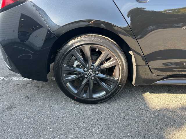 トヨタ カローラツーリング ハイブリッド ダブルバイビー 大阪府 2023(令5)年 1.1万km アティチュードブラックマイカ ワンオーナー/ブラインドスポットモニター/純正10.5型ナビ(BT/USB/フルセグ)/バックカメラ/衝突被害軽減システム/レーンキープアシスト/コーナーセンサー/アダクティブクルーズコントロール/オートライト/オートマチックハイビーム/純正アルミホイール/社外フロアマット/ハーフレザー/ビルトインETC/スマートキー/LEDヘッドライト