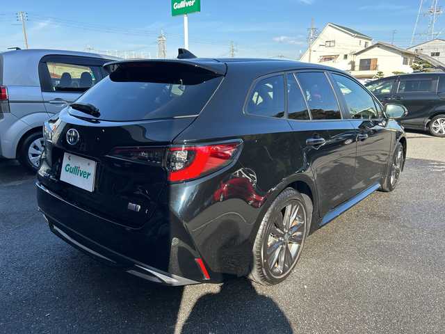 トヨタ カローラツーリング ハイブリッド ダブルバイビー 大阪府 2023(令5)年 1.1万km アティチュードブラックマイカ ワンオーナー/ブラインドスポットモニター/純正10.5型ナビ(BT/USB/フルセグ)/バックカメラ/衝突被害軽減システム/レーンキープアシスト/コーナーセンサー/アダクティブクルーズコントロール/オートライト/オートマチックハイビーム/純正アルミホイール/社外フロアマット/ハーフレザー/ビルトインETC/スマートキー/LEDヘッドライト