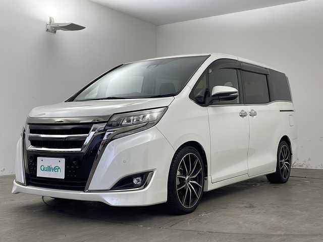 トヨタ エスクァイア Gi プレミアムパッケージ ブラックテーラード 兵庫県 2019(令1)年 4.4万km ホワイトパールクリスタルシャイン ・ALPINEナビ&TV&CD&DVD&SD&BT/・バックカメラ/・両側パワースライドドア/・クルーズコントロール/・純正前後ドライブレコーダー/・ハーフレザーシート/・シートヒーター/・ステアリングヒーター/・トヨタセーフティセンス/・プリクラッシュセーフティ/・クリアナンスソナー/・パーキングサポートブレーキ/・レーンディパーチャーアラート/・オートマチックハイビーム/・ビルトインETC/・nanoe/・純正ウッドコンビステアリング/・社外18インチアルミホイール/・LEDオートライト/・LEDフォグランプ/・社外サスショック/・アイドリングストップ/・純正フロアマット/・スマートキー/・プッシュスタート