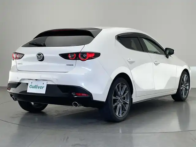 マツダ マツダ３ファストバック 20S Lパッケージ 愛知県 2019(令1)年 1.6万km スノーフレイクホワイトパールマイカ 純正８．８型ナビ　黒革　ＨＤＭＩ　禁煙車　ＨＵＤ　バックカメラ　シートヒーター　ＢＳＭ　前後ドラレコ　ＥＴＣ　衝突軽減　追従クルコン　メモリーシート　ＬＥＤオートライト　オートワイパー　フルセグＴＶ　DVD再生　
