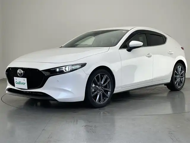 マツダ マツダ３ファストバック 20S Lパッケージ 愛知県 2019(令1)年 1.6万km スノーフレイクホワイトパールマイカ 純正８．８型ナビ　黒革　ＨＤＭＩ　禁煙車　ＨＵＤ　バックカメラ　シートヒーター　ＢＳＭ　前後ドラレコ　ＥＴＣ　衝突軽減　追従クルコン　メモリーシート　ＬＥＤオートライト　オートワイパー　フルセグＴＶ　DVD再生　