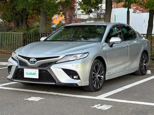 トヨタ カムリ WS ブラックエディション 宮城県 2020(令2)年 8.2万km シルバーM トヨタセーフティセンス/・プリクラッシュセーフティ/・レーダークルーズコントロール/・レーントレーシングアシスト/・レーンディパーチャーアラート/・オートマチックハイビーム/・ロードサインアシスト/・パーキングサポートブレーキ/・ブラインドスポットモニター/・リヤクロストラフィックアラート/純正ナビ/・Bluetooth/CD/DVD/フルセグ/USB/・バックカメラ/・純正ビルドインETC/・ヘッドアップディスプレイ/・ドライブレコーダー前方/アイドリングストップ/コーナーセンサー前後/革巻きステアリング/・ステアリングスイッチ/・パドルシフト/プッシュスタート/・スマートキー/レザーシート/・シートヒーター（運転席＋助手席）/・パワーシート（運転席＋助手席）/オートライト/ドアバイザー/純正フロアマット/純正18インチアルミホイール/純正LEDヘッドライト