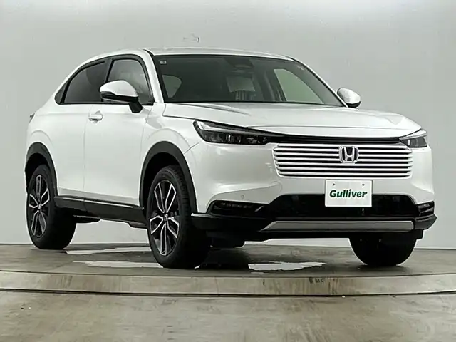 ホンダ ヴェゼル ハイブリッド e:HEV Z 愛知県 2025(令7)年 0.1万km未満 パール 登録未使用車/Honda CONNECTディスプレーオーディオ/・フルセグTV/BT/Apple Car Play/Android Auto/ETC2.0車載器/ワイヤレス充電器/ホンダセンシング/・衝突被害軽減システム/・レーンキープアシスト/・クルーズコントロール/・オートマチックハイビーム/電動リアゲート/ブラインドスポットモニター/LEDヘッドライト/電子パーキングスイッチ/ハーフレザーシート/前席シートヒーター/純正18インチAW/革巻きステアリング/ステアリングヒーター/ステアリングスイッチ/スマートキー＆プッシュスタート
