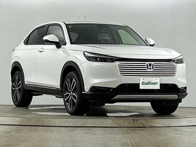 ホンダ ヴェゼル ハイブリッド e:HEV Z 愛知県 2025(令7)年 0.1千km パール 登録未使用車/Honda CONNECTディスプレーオーディオ/・フルセグTV/BT/Apple Car Play/Android Auto/ETC2.0車載器/ワイヤレス充電器/ホンダセンシング/・衝突被害軽減システム/・レーンキープアシスト/・クルーズコントロール/・オートマチックハイビーム/電動リアゲート/ブラインドスポットモニター/LEDヘッドライト/電子パーキングスイッチ/ハーフレザーシート/前席シートヒーター/純正18インチAW/革巻きステアリング/ステアリングヒーター/ステアリングスイッチ/スマートキー＆プッシュスタート