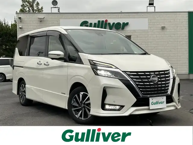 日産 セレナ ハイウェイスター V 島根県 2021(令3)年 1.8万km ブリリアントホワイトパール 純正10型ＳＤナビ　/フルセグＴＶ　/ＤＶＤ再生　/Ｂｌｕｅｔｏｏｔｈ接続　/バック／サイド／フロント／全方位カメラ　/前後ドライブレコーダー　/ビルトインＥＴＣ　/両側パワースライドドア　/レーダークルーズコントロール　/衝突軽減ブレーキ/アイドリングストップ/レーンキープアシスト/前後コーナーセンサー/スマートキー/プッシュスタート　/純正ＬＥＤヘッドライト　/純正１５インチアルミホイール/純正フロアマット/スペアキー