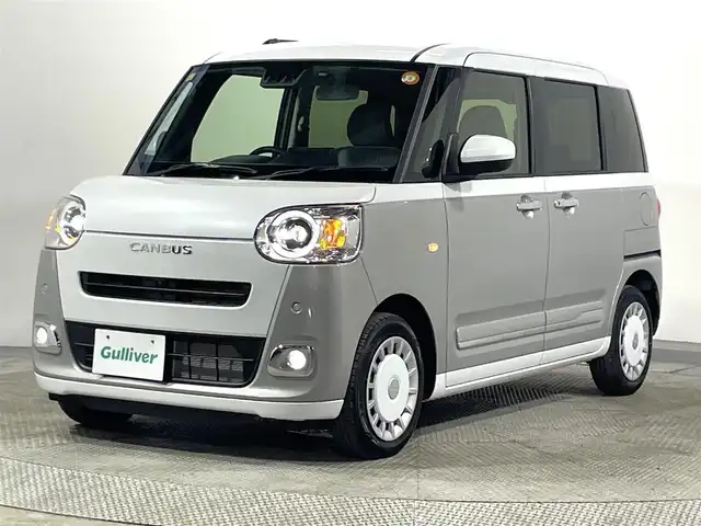 ダイハツ ムーヴ キャンバス ストライプス G 大阪府 2023(令5)年 0.5万km シャイニングホワイトパール/スムーズグレーマイカメタリック 純正ナビTV 360カメラ 両側パワースライドドア シートヒーター 衝突軽減ブレーキ レーンアシスト スマートキー プッシュスタート クリアランスソナー ドリンクヒーター ドライブレコーダー LEDヘッドライト